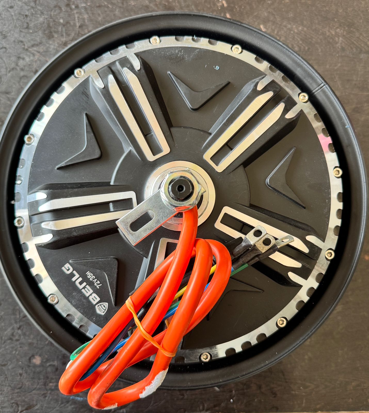 Motor wheel with wiring on a dark background